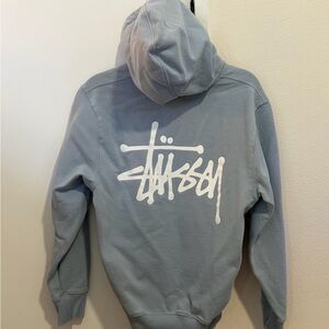 Stussy Light Blue Hoodie with White Graphic